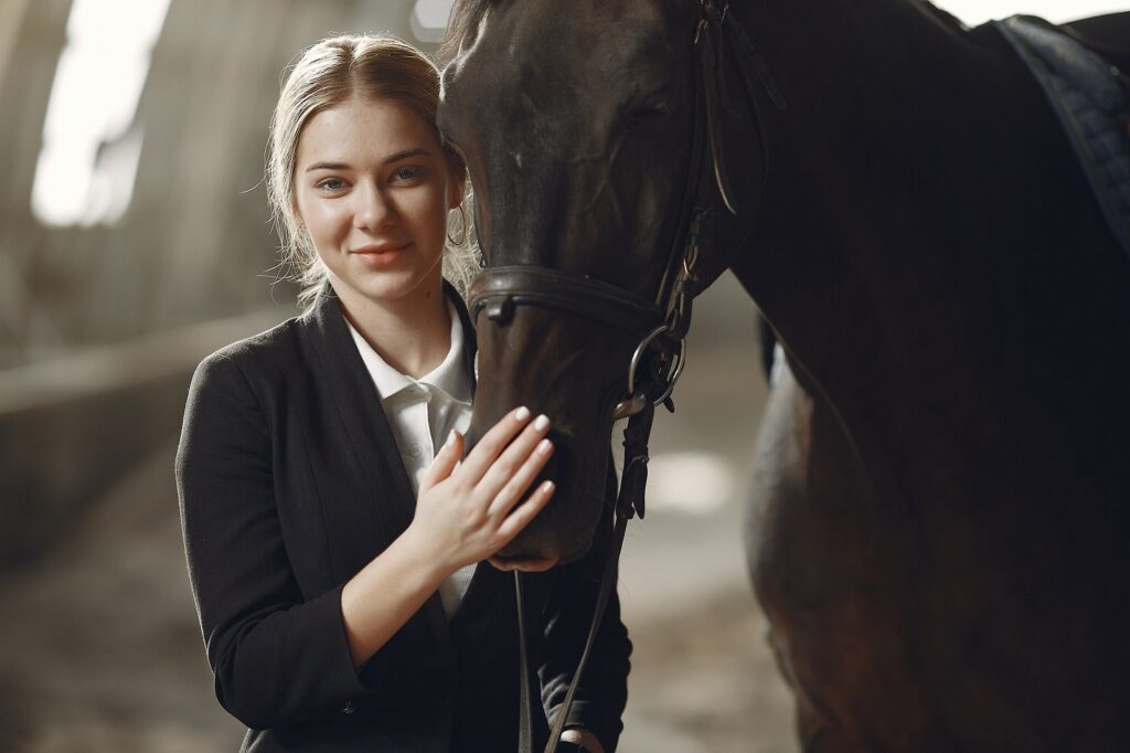 The rider in black form trains with the horse